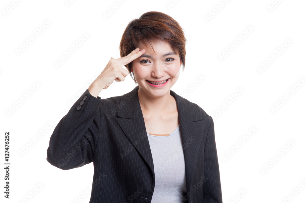 Beautiful young Asian woman holding fingers in gun gesture. Beautiful young Asian woman holding fingers in gun gesture.