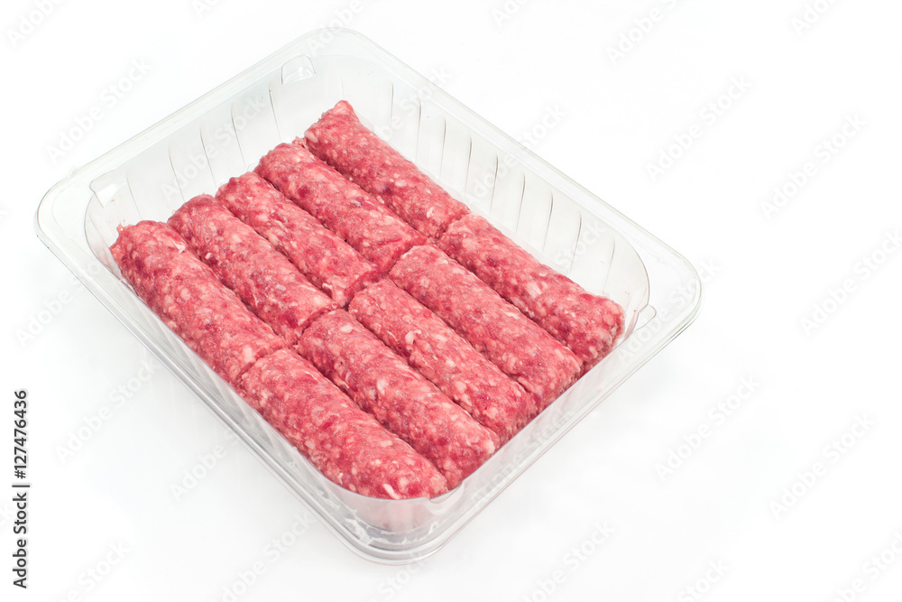 Raw kebab minced meat in plastic bowl isolated on white Raw kebab minced meat in plastic bowl isolated on white