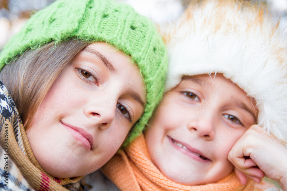 Closeup portrait of two happy little sisters in autumn day Closeup portrait of two happy little sisters in autumn day