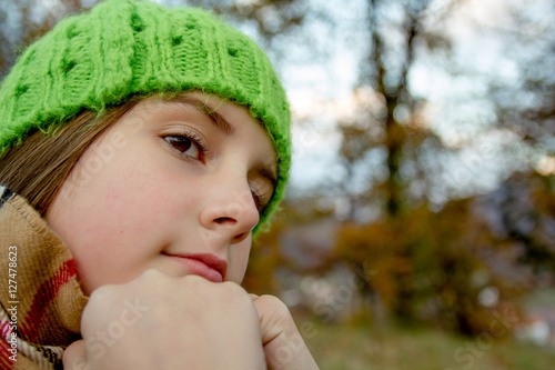 Little girl in autumn day