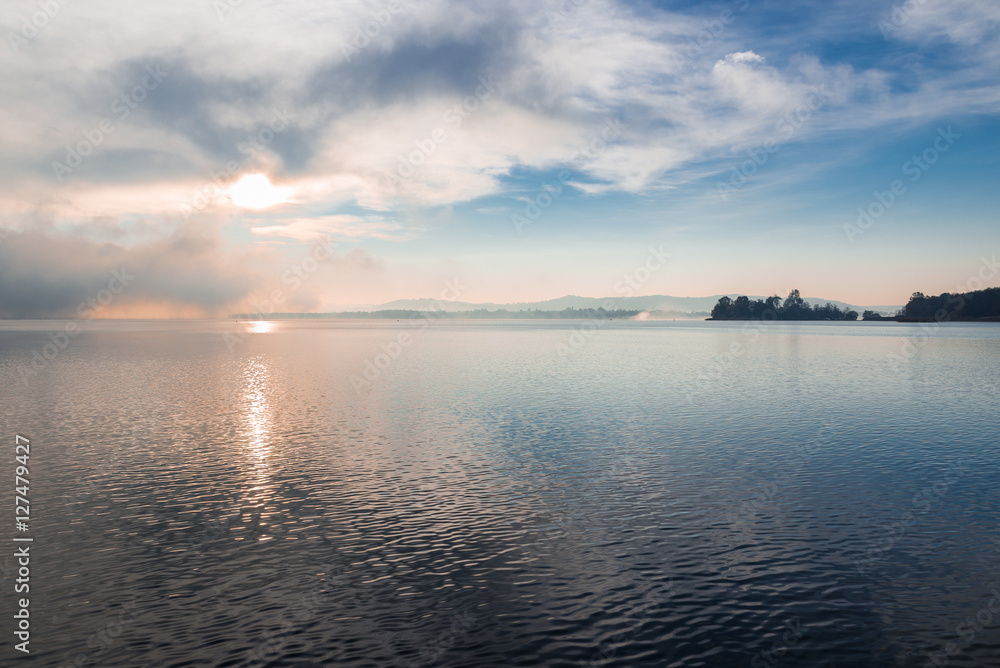 Lake Varese and, to the right, the islet Virginia; Biandronno, province of Varese, Italy in a picturesque autumnal morning  