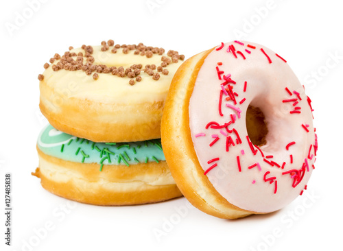 Three donuts with decorated sprinkles