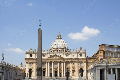 View of Saint Peter Square in Vatican. Landmark area with columns, fountains & Egyptian obelisk where crowds gather for Pope's address.