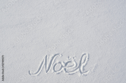 Noel letters handdrawn on flat snow surface. Nice christmas holiday horoizontal postcard, greeting card template. Empty space for copy, text, lettering.