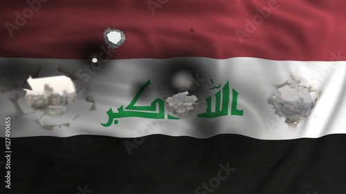 iraq flag with bullet holes waving photo