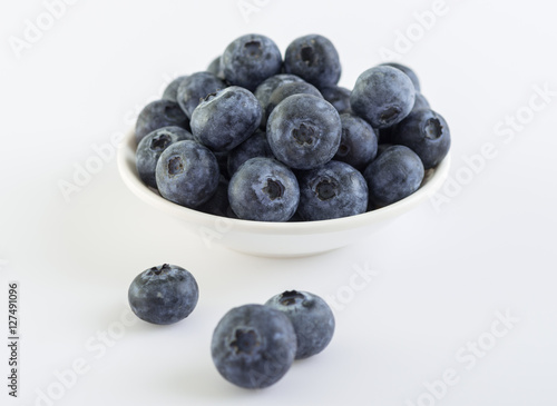 Group of fresh juicy blueberries on white background