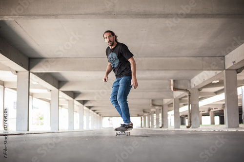 Professional skateboarder in underground passage