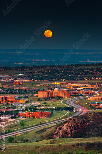 Moon rise over Denver and Golden Colorado in summer