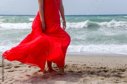 woman in red dress on beach