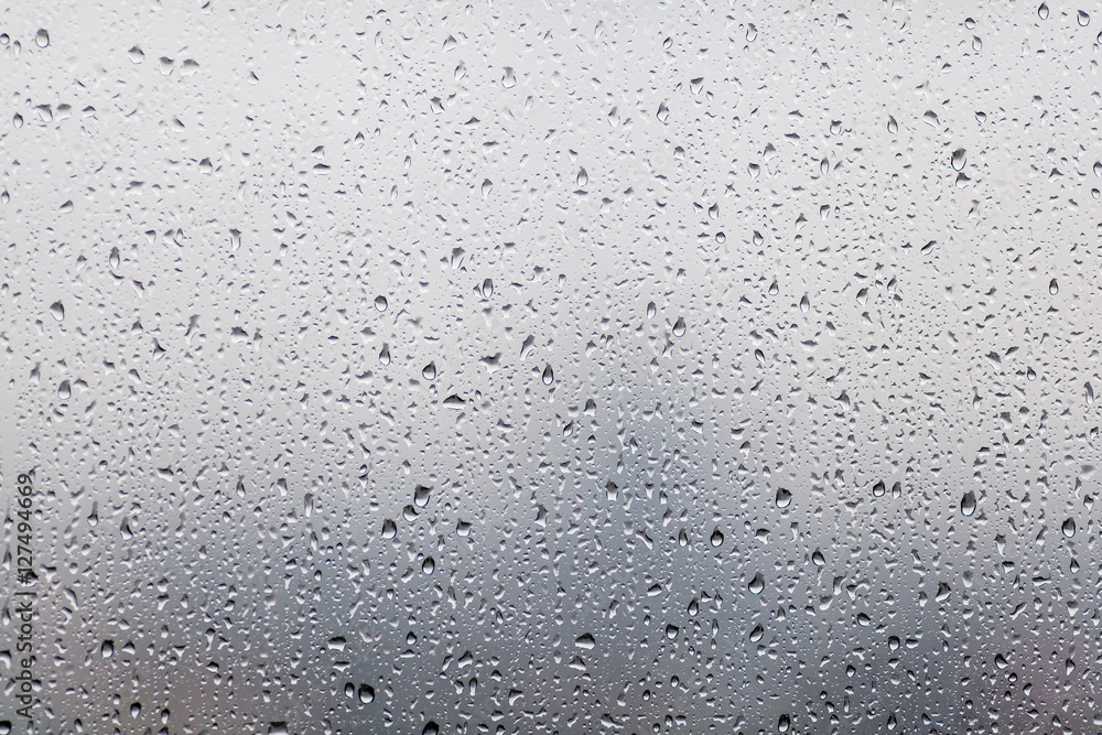 Rain drops on window glasses surface with cloudy background . Na Rain drops on window glasses surface with cloudy background . Na