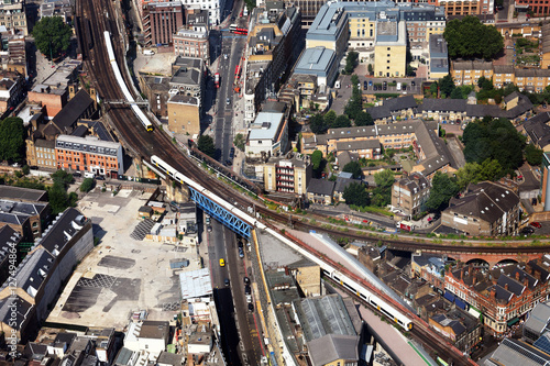 Trains travelling on city's railway infrastructure as seen from The Shard skyscraper at London Bridge