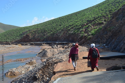 Villagers travel long distances on foot after roads damaged by the floods in southern Morocco