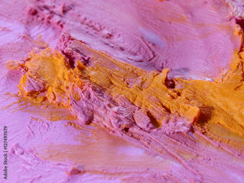 Pink and orange colors smeared on the wall. Interior material design.