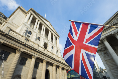 British Union Jack flag flying in front of the Bank of England in the City of London financial center photo