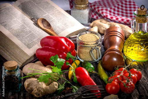 Fototapeta Naklejka Na Ścianę i Meble -  Old cook book with  ingredients