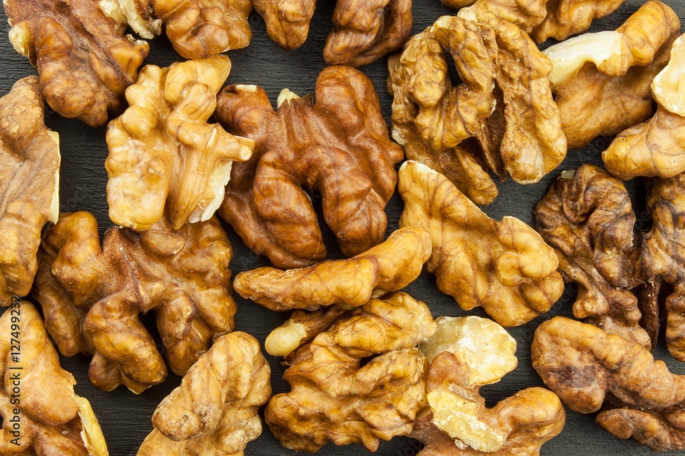 Closeup of big shelled walnuts pile. We like walnuts. Advertising on walnuts. Superfoods for the human brain.
Closeup of big shelled walnuts pile. We like walnuts. Advertising on walnuts. Superfoods for the human brain.