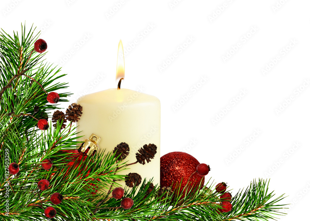 Christmas corner decoration with pine twigs, candle and balls