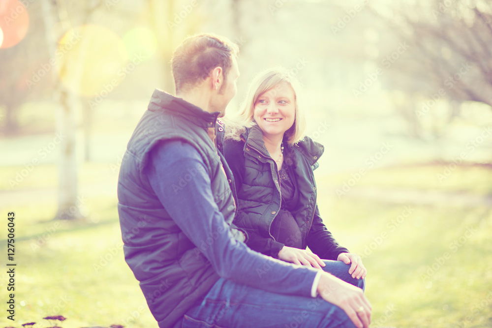 Fototapeta premium man and his pregnant wife in the park