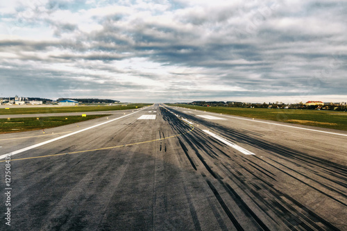 Airplane runway. Detail of runway with pattern of wheels photo