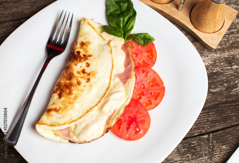 Folded omelette with cheese and ham