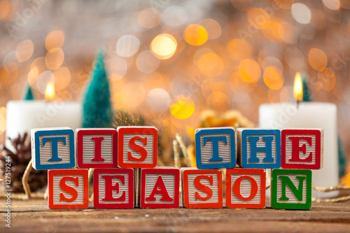 Tis The Season Written With Toy Blocks On Christmas Card Backgro photo
