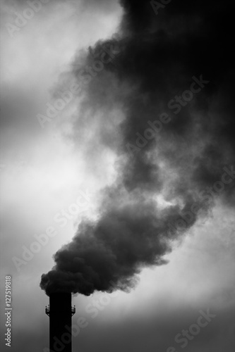 Environmental Damage: Air Pollution. The black smoke of the pipe.
