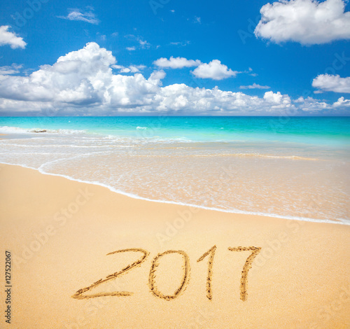 2017 written on sandy beach