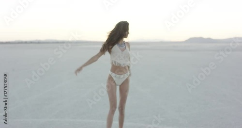 Exotic girl dancing in the desert