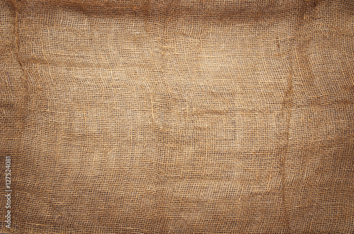 Linen fabric background with visible texture. Horizontal photo taken from above, top view with copy space for packaging, text and other web or print design elements.