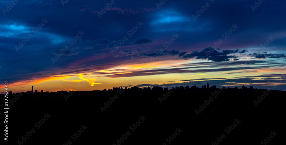 Panoramic view of the big city silhouette against the backdrop of incredibly, awesome bright, colored sunset. Kyiv. Ukraine.