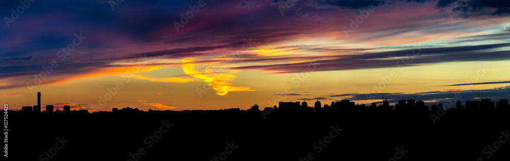 Panoramic view of the big city silhouette against the backdrop of incredibly, awesome bright, colored sunset. Kyiv. Ukraine. Panoramic view of the big city silhouette against the backdrop of incredibly, awesome bright, colored sunset. Kyiv. Ukraine.