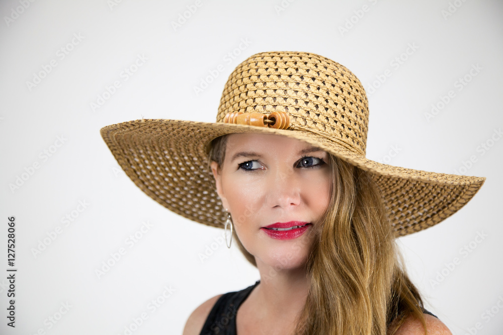 Mature Blonde Female In Large Hat Eyes Looking Away From Camera Mature Blonde Female In Large Hat Eyes Looking Away From Camera