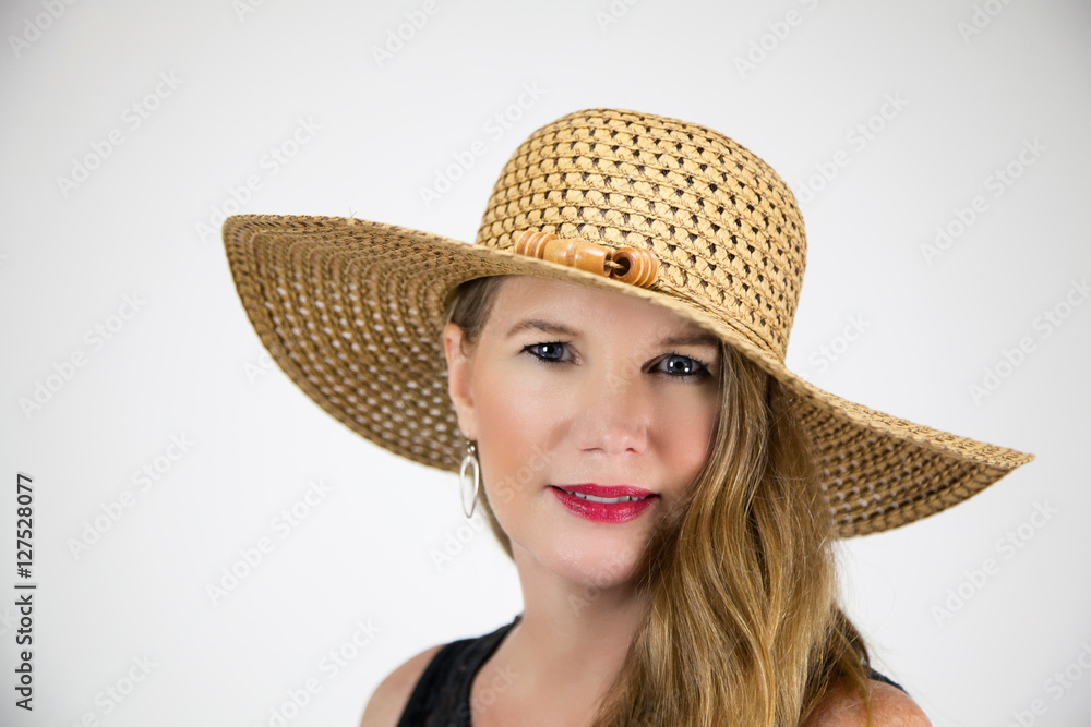 Mature Blonde Female In Large Hat Smiling Looking At Camera Mature Blonde Female In Large Hat Smiling Looking At Camera