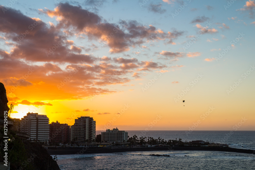 Magnificent sunset aerial view of beach and buildings of Tenerife, Spain.