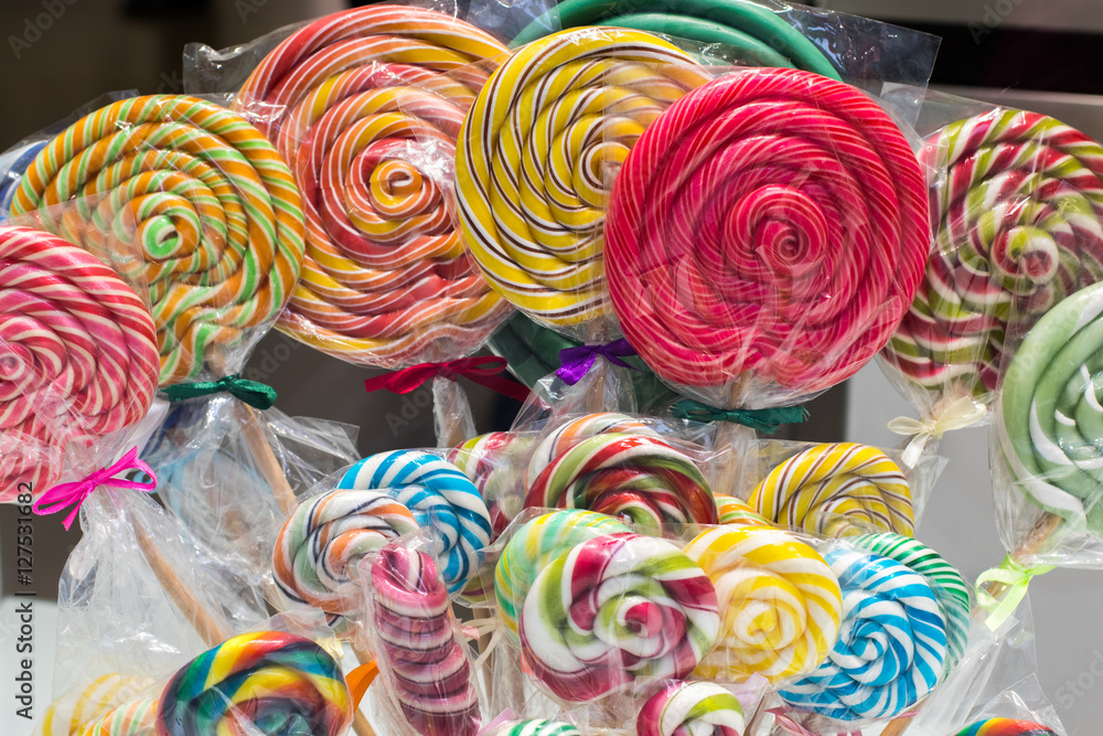 Colorful handmade lollipops on display, small and big lollipops