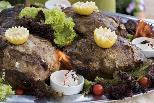 whole roasted veal flame. Italian typical cuisine