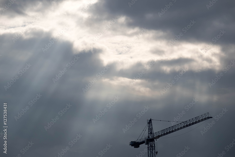 Crane and Cloud with cloudy sky.
