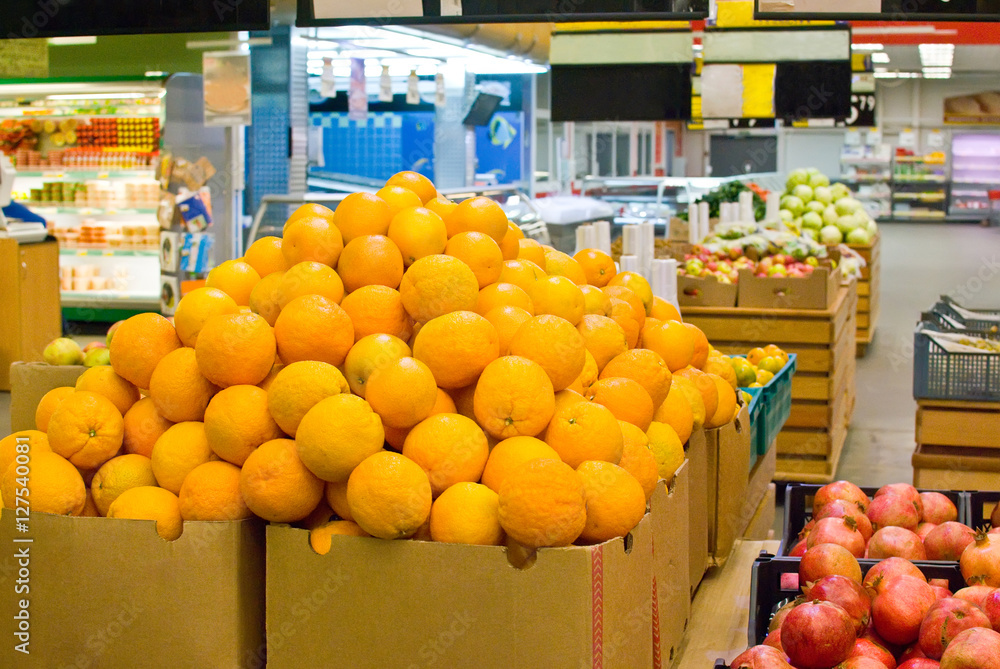 orange in boxes in supermarket 