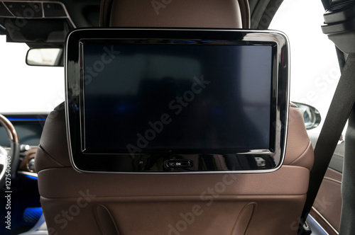 Business car interior detail. Screen multimedia system.