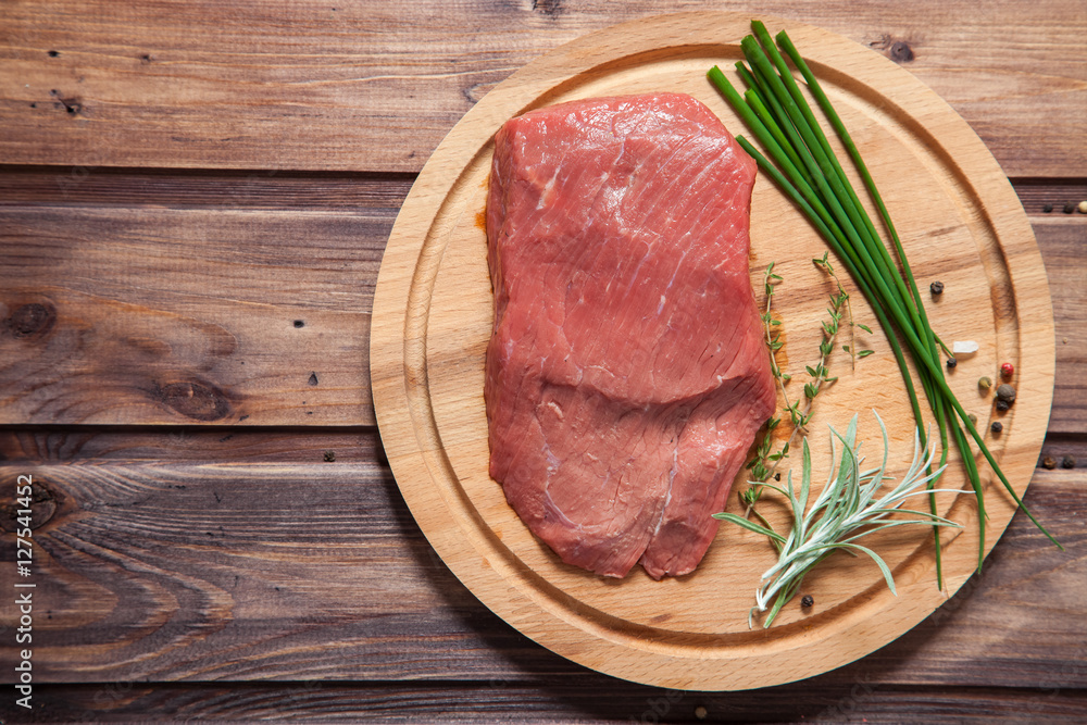 piece of beef and vegetables on a table, selective focus piece of beef and vegetables on a table, selective focus