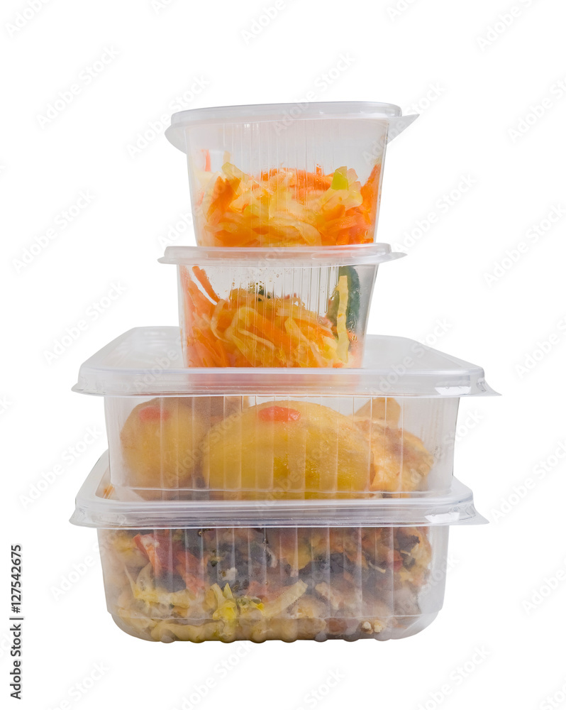 Baked meat with potatoes in a plastic food container. Isolated on white background