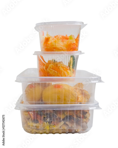 Obraz na płótnie Baked meat with potatoes in a plastic food container. Isolated on white background w salonie