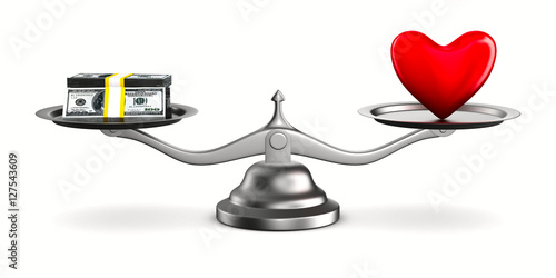 Heart and money on scales. ...