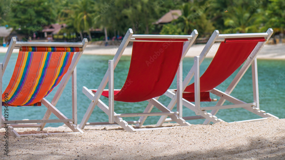 Appealing Beach Chairs on Sand. Palm Trees and Ocean in Background. Haad Salat. Koh Pangang, Thailand Appealing Beach Chairs on Sand. Palm Trees and Ocean in Background. Haad Salat. Koh Pangang, Thailand