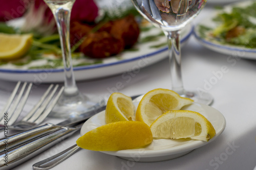 Lemons in a plate on the table photo