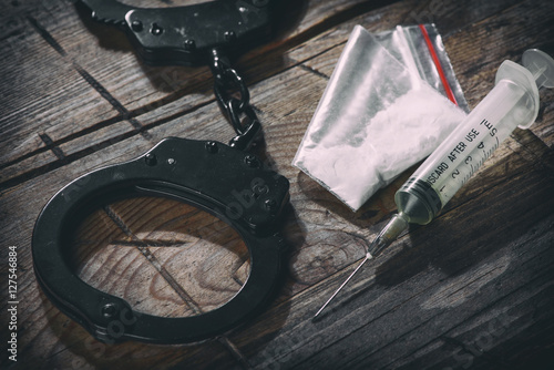 handcuffs and narcotic