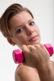 young woman weightlifting in a fitness mood