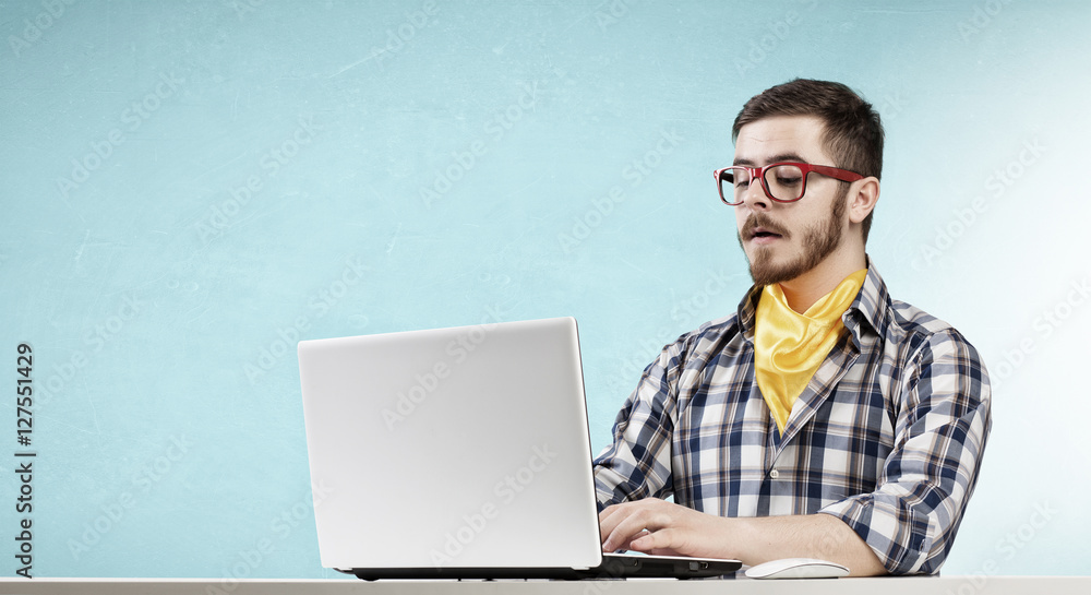 Hipster guy use laptop . Mixed media Hipster guy use laptop . Mixed media