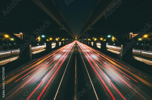 Wallpaper Mural Fast moving traffic with red light trails on black asphalt motorway Torontodigital.ca