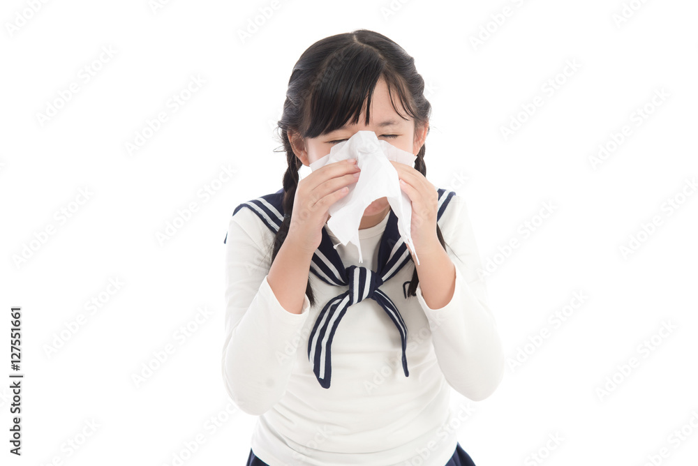 Beautiful Asian girl blows her nose on white background Beautiful Asian girl blows her nose on white background